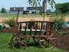 http://amishshop.com/hazel-doc/imageamish2007/goatwagongldbrwnside.jpg (210638 bytes)