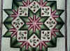 http://amishshop.com/hazel-doc/imageamish2008/quilt8pointtulipwreathcu.jpg (185336 bytes)